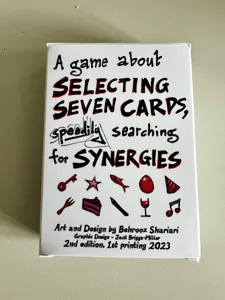 A game about selecting seven cards, speedily searching for synergies. box cover