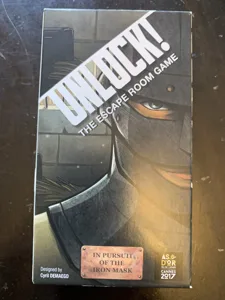 Unlock!: The Escape Room Game – In Pursuit of the Iron Mask box cover