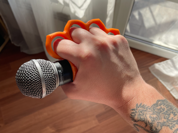 Brass knuckles microphone holder