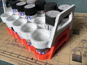 A stackable paint rack / carrier for 11 x 23ml Tamiya paint pots.