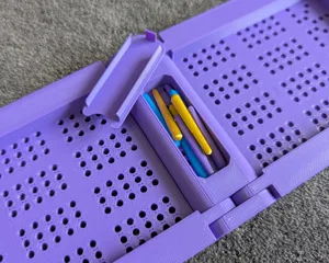 Pegs and storage cap for folding cribbage board
