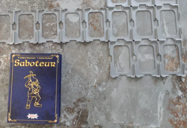 "Saboteur" card holder/playing field