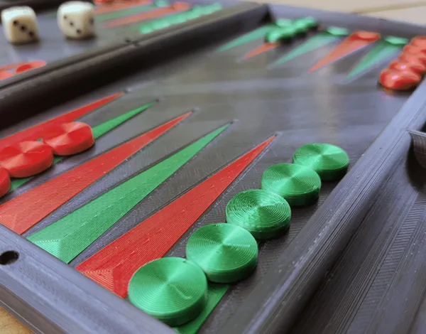Backgammon with magnetic hinges