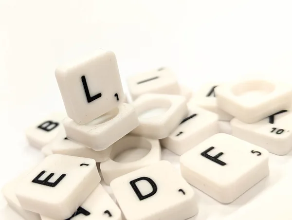 Scrabble lettter tile/rock/stone - L