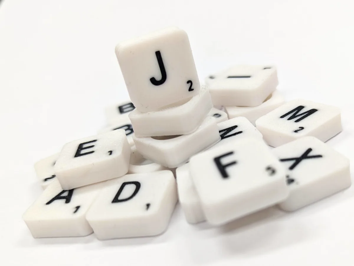 Scrabble letter tile/rock/stone - J