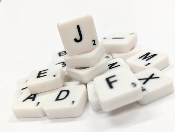 Scrabble letter tile/rock/stone - J