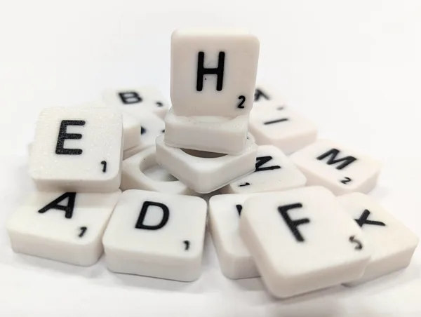 Scrabble letter tile/rock/stone - H