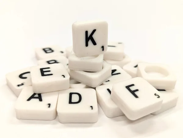 Scrabble letter tile/rock/stone - K
