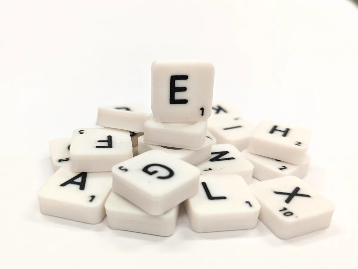 Scrabble letter tile/rock/stone - E