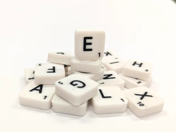 Scrabble letter tile/rock/stone - E