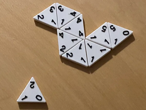 Triominos: Dominoes Variant using Triangular Tiles