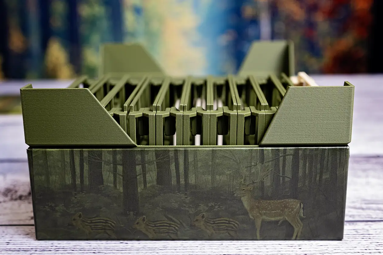 Side view of Forest Shuffle insert. Significant box lift to accommodate tree trays