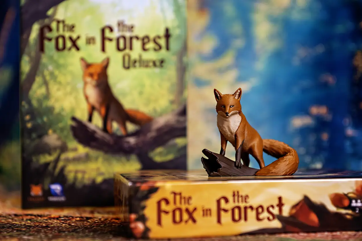A Fox next to two boxes